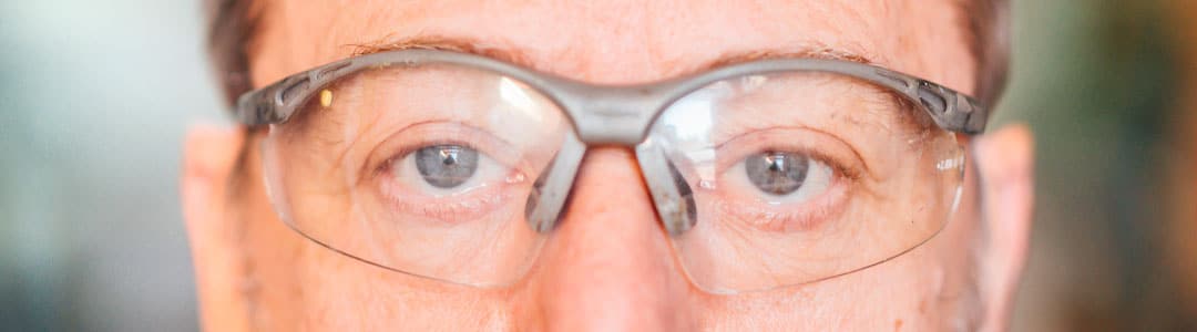 How should safety glasses fit?